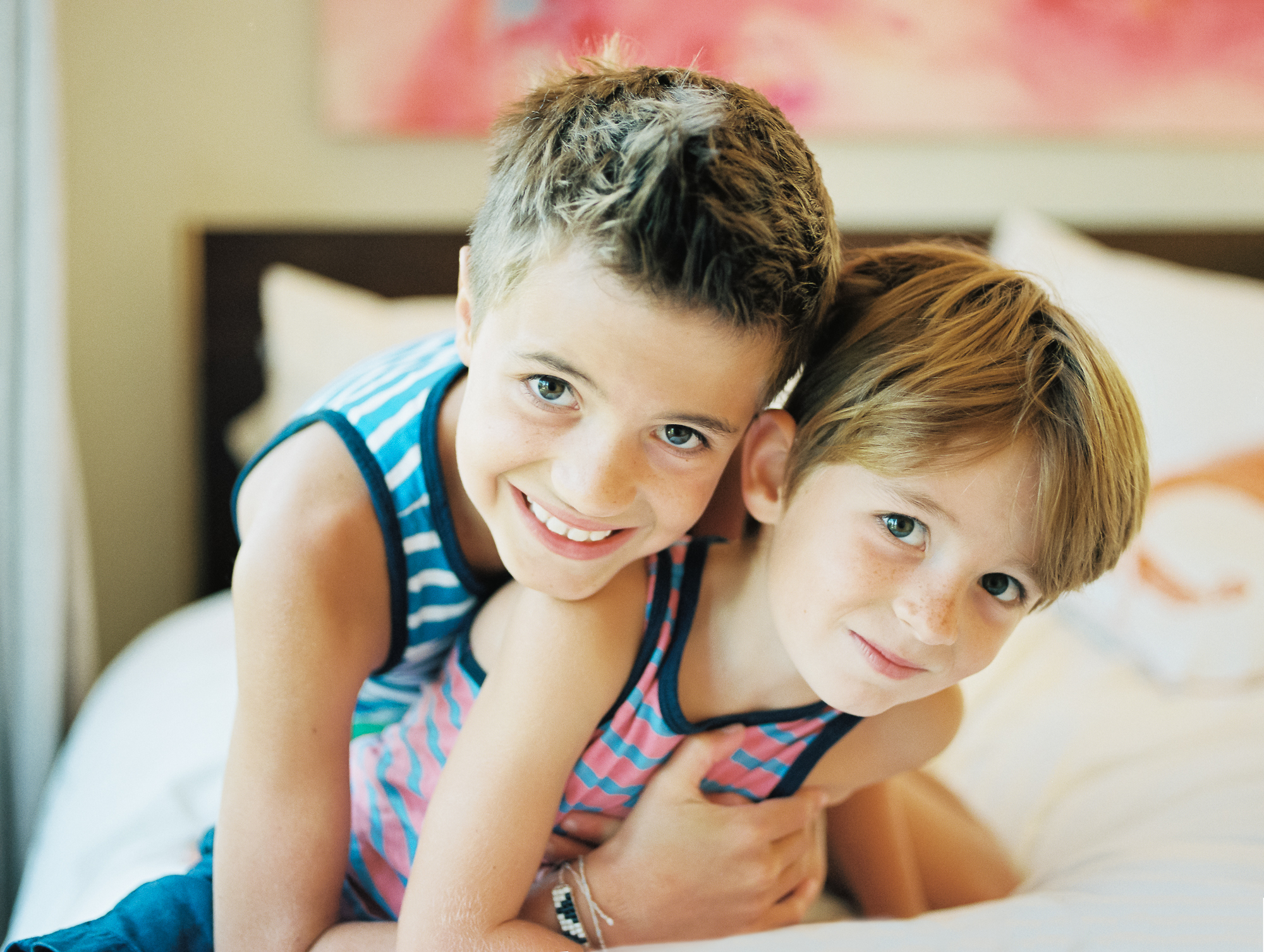 casual portrait of young brothers. Photographed in their home during a family photography session.